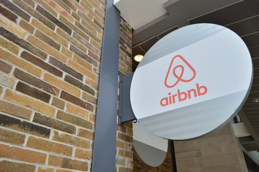 a sign on a building says airbnb