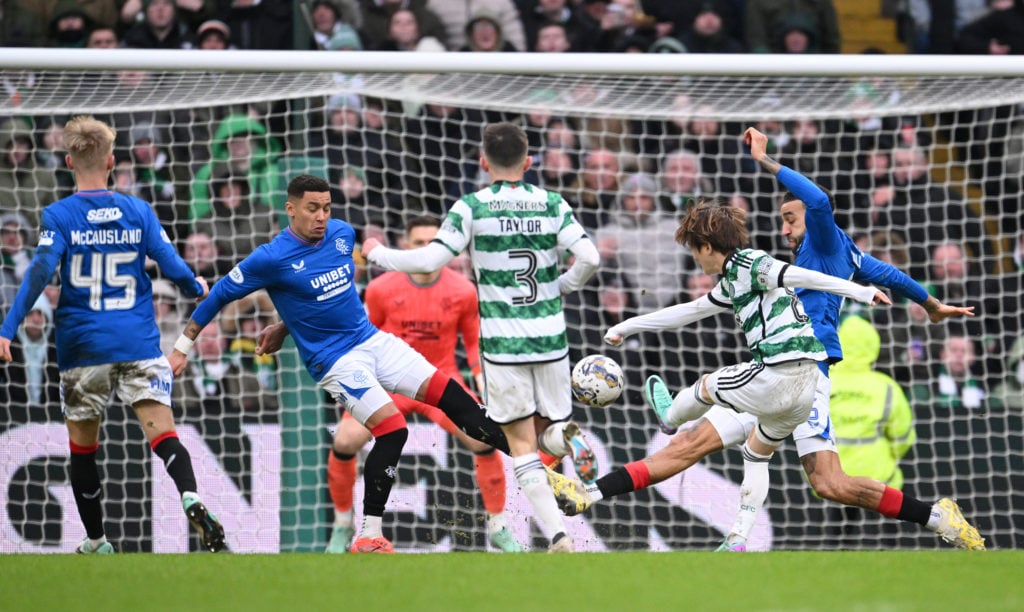 Kyogo Furuhashi of Celtic shoots to score their team's second goal during the Cinch Scottish Premiership match between Celtic FC and Rangers FC at ...