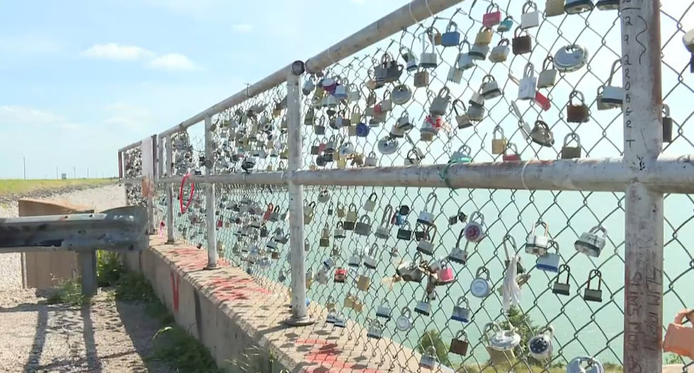 FILE: The parking lot was serving as an overlook and as a “love lock” location to the public,...