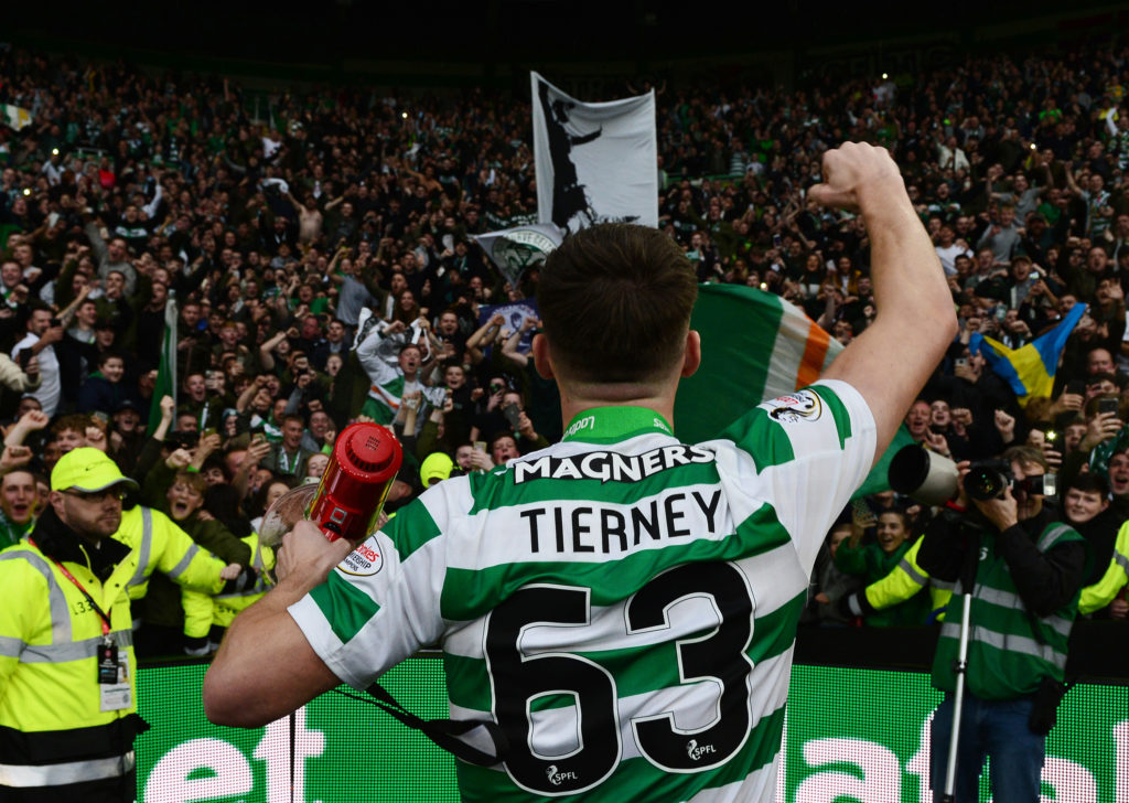 Kieran Tierney of Celtic celebrate with the Celtic fans during the Ladbrokes Scottish Premiership match between Celtic FC and Heart of Midlothian F...