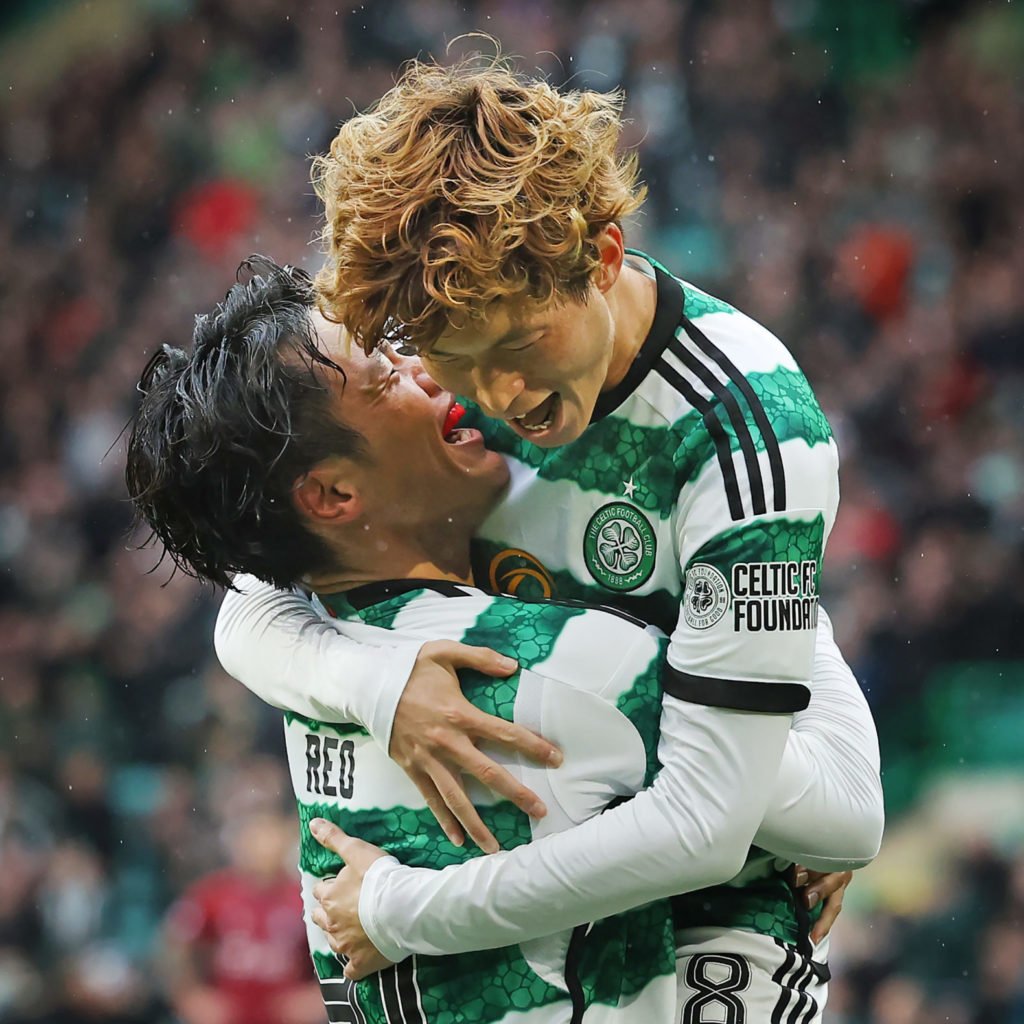 Kyogo Furahashi congratulates Reo Hatate after he scores the opening goal during the Cinch Scottish Premiership match between Celtic FC and Kilmarn...