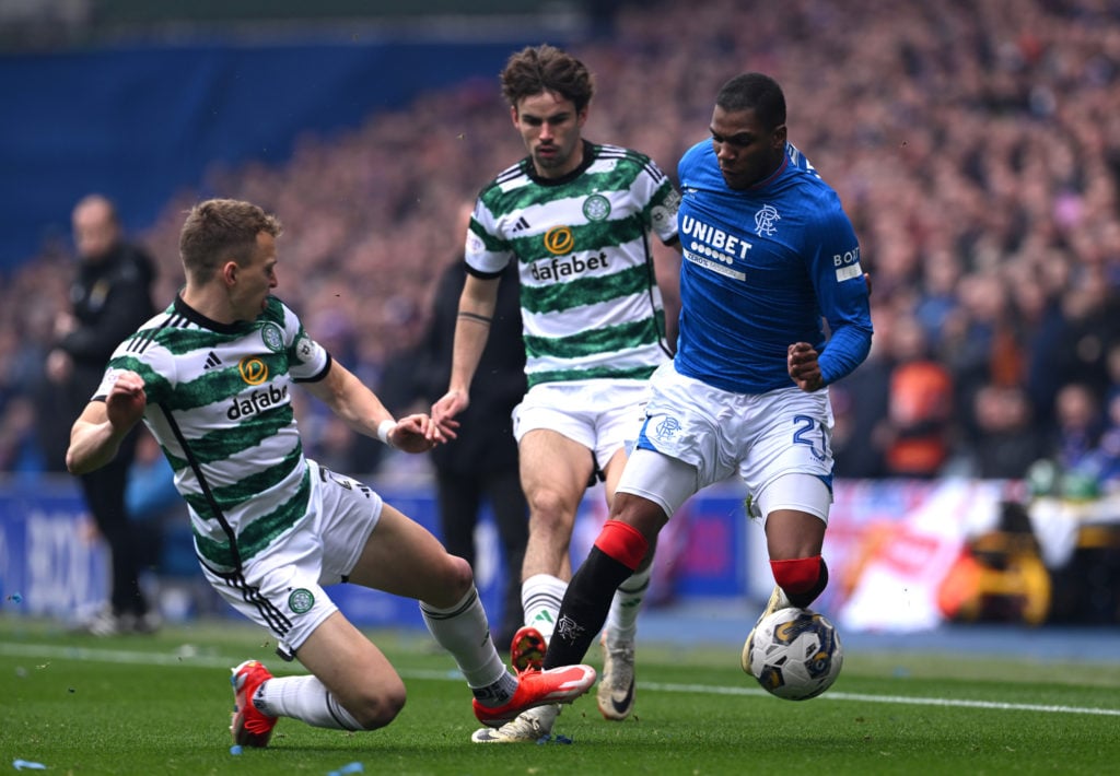 Alistair Johnston of Celtic battles for possession with Dujon Sterling of Rangers during the Cinch Scottish Premiership match between Rangers FC an...