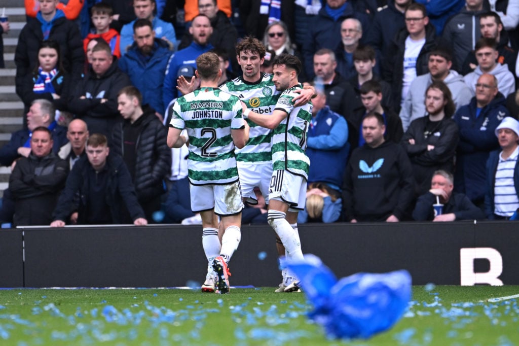 Matt O'Riley of Celtic celebrates scoring his team's second goal with teammates during the Cinch Scottish Premiership match between Rangers FC and ...