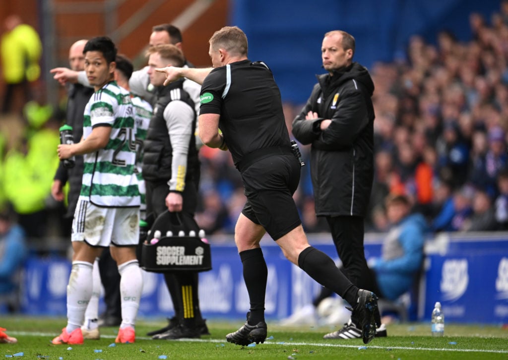 Referee John Beaton awards a penalty to Celtic after a VAR check during the Cinch Scottish Premiership match between Rangers FC and Celtic FC at Ib...